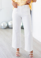 Person wearing white pants with a blurred background