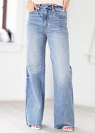 Light blue jeans worn by a person on a white background