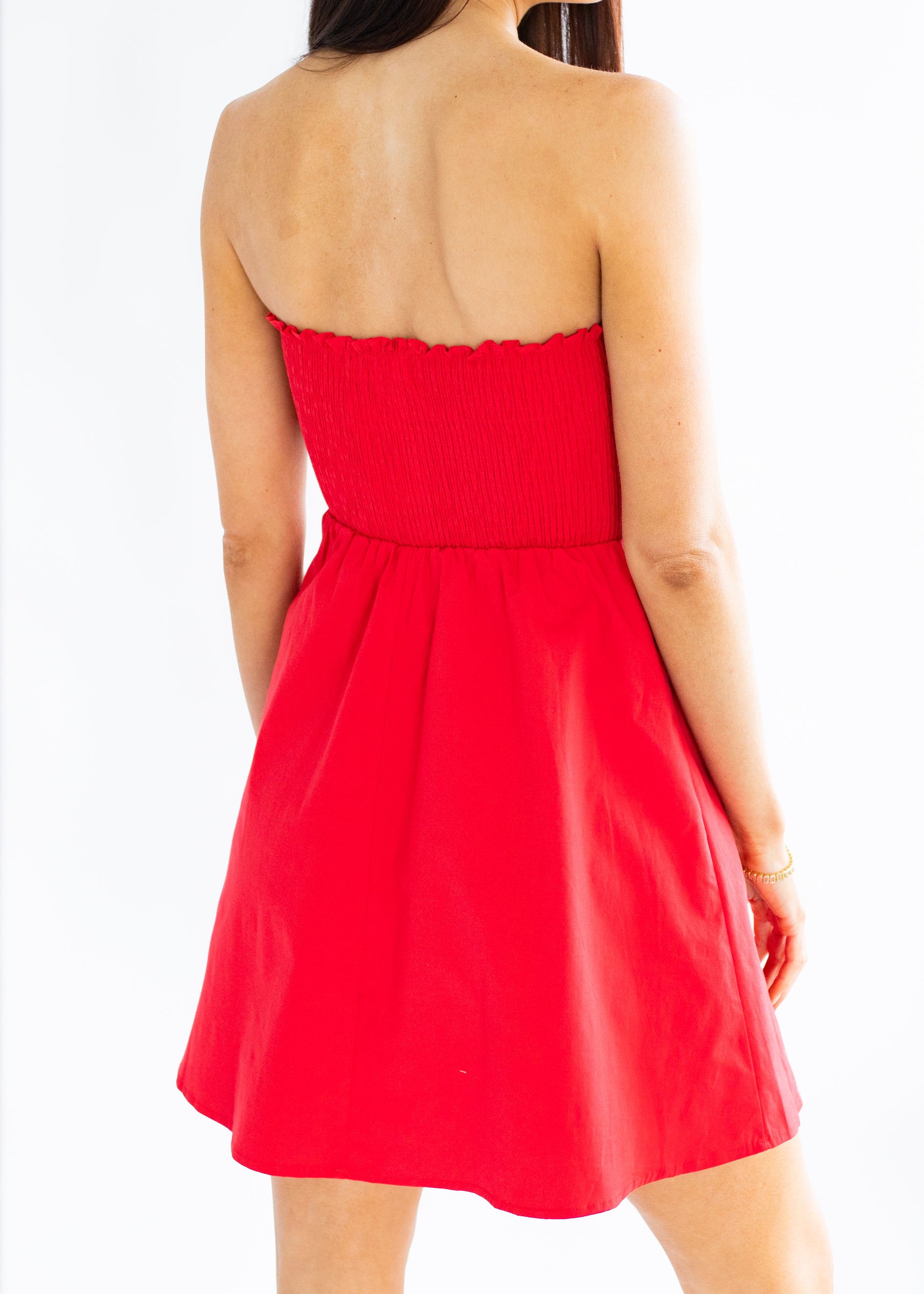 Red strapless dress on a white background
