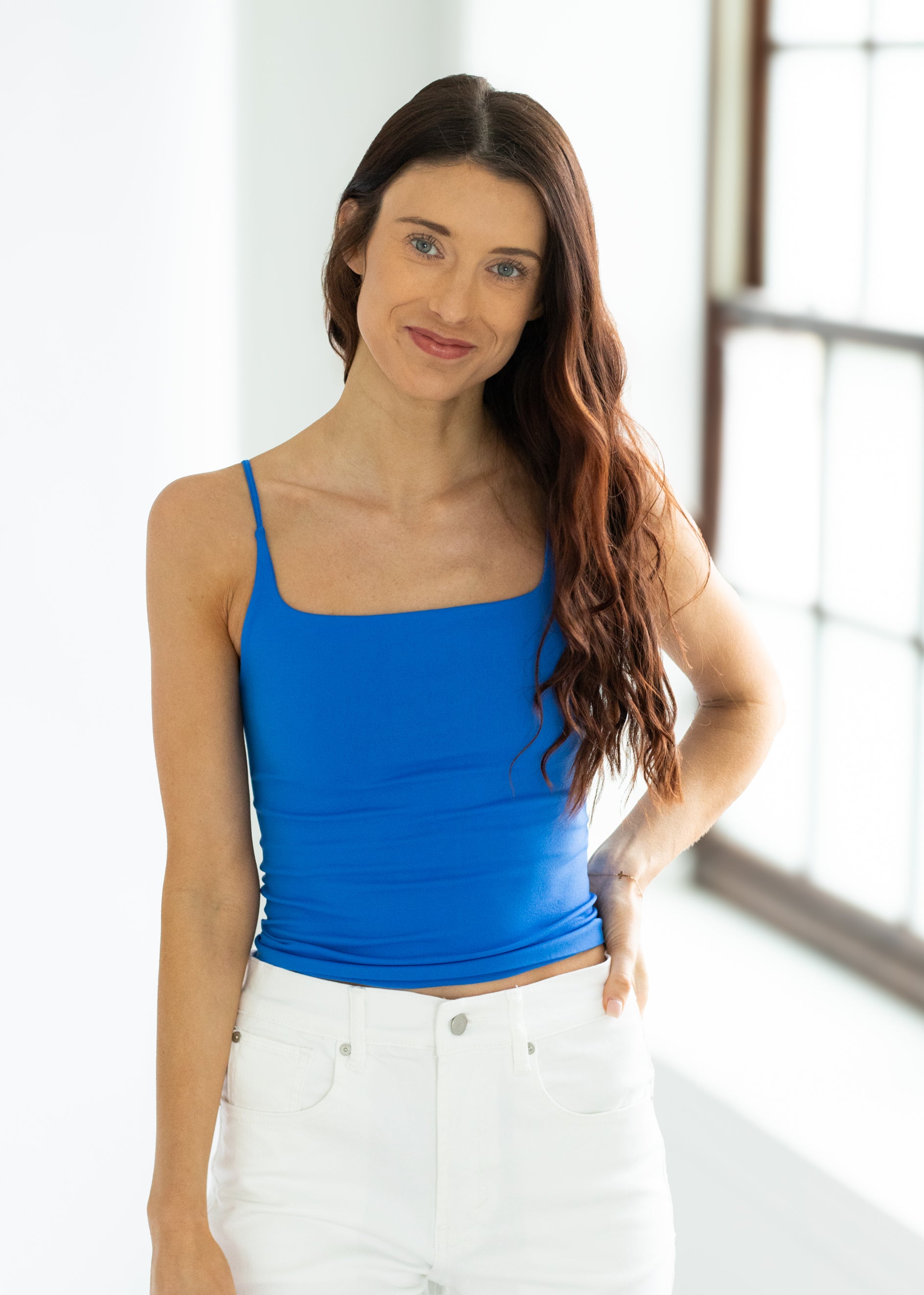 woman wearing a bright blue fitted tank