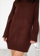 Brown sweater dress worn by a person on a white background