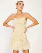 Woman wearing a light-colored dress on a white background