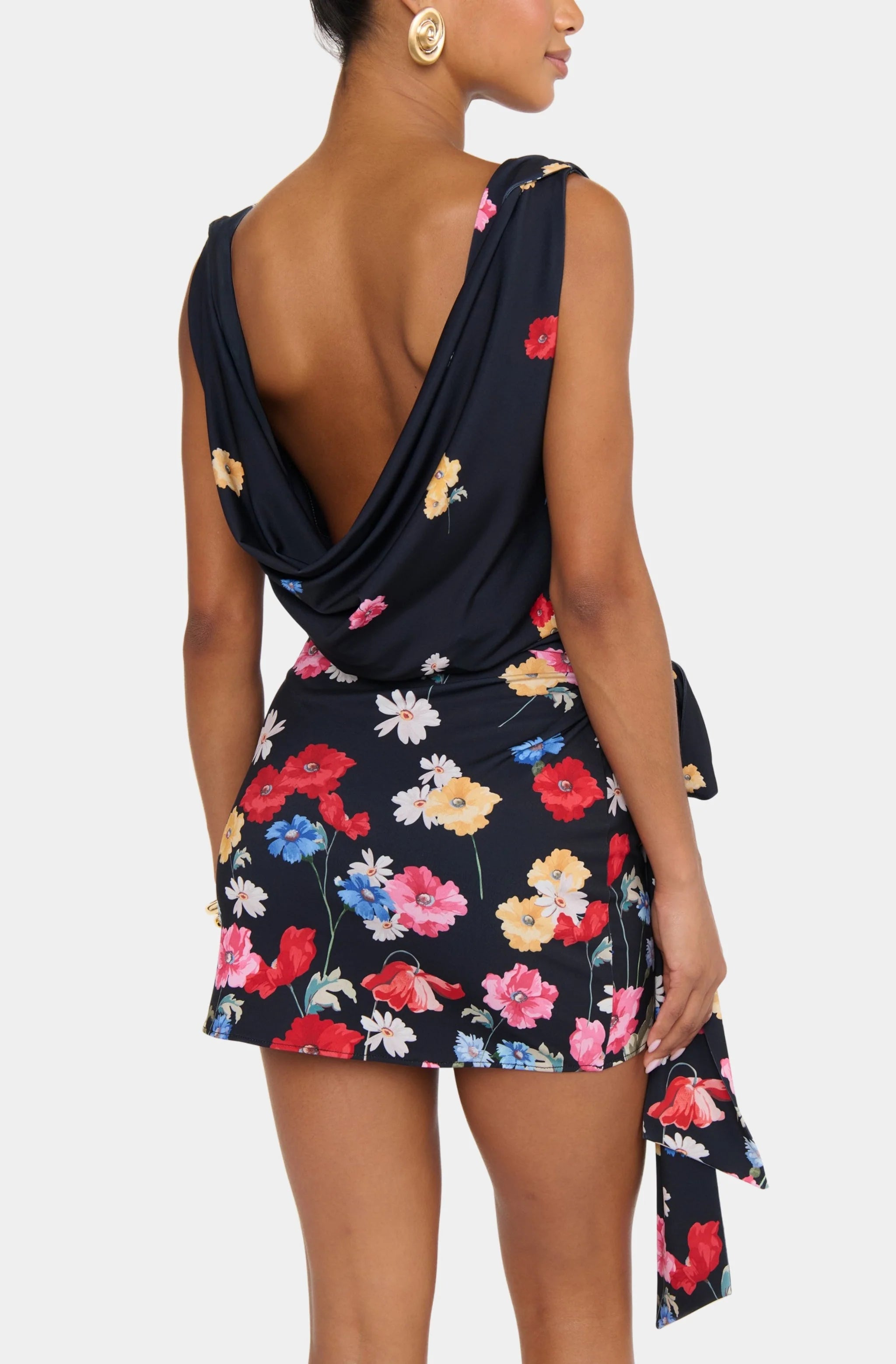 Woman wearing a floral dress with a white background