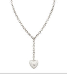 Silver necklace with a heart pendant on a white background