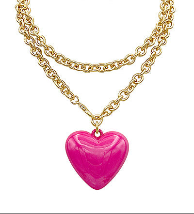 Gold chain necklace with a pink heart pendant on a white background