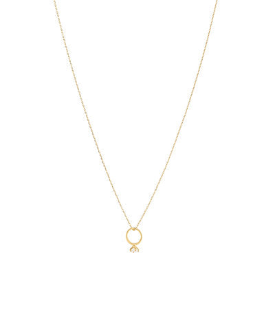 Gold necklace with a small ring pendant on a white background