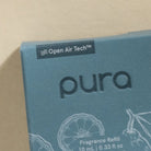 Pura fragrance refill packaging with Open Air Tech branding on a beige background