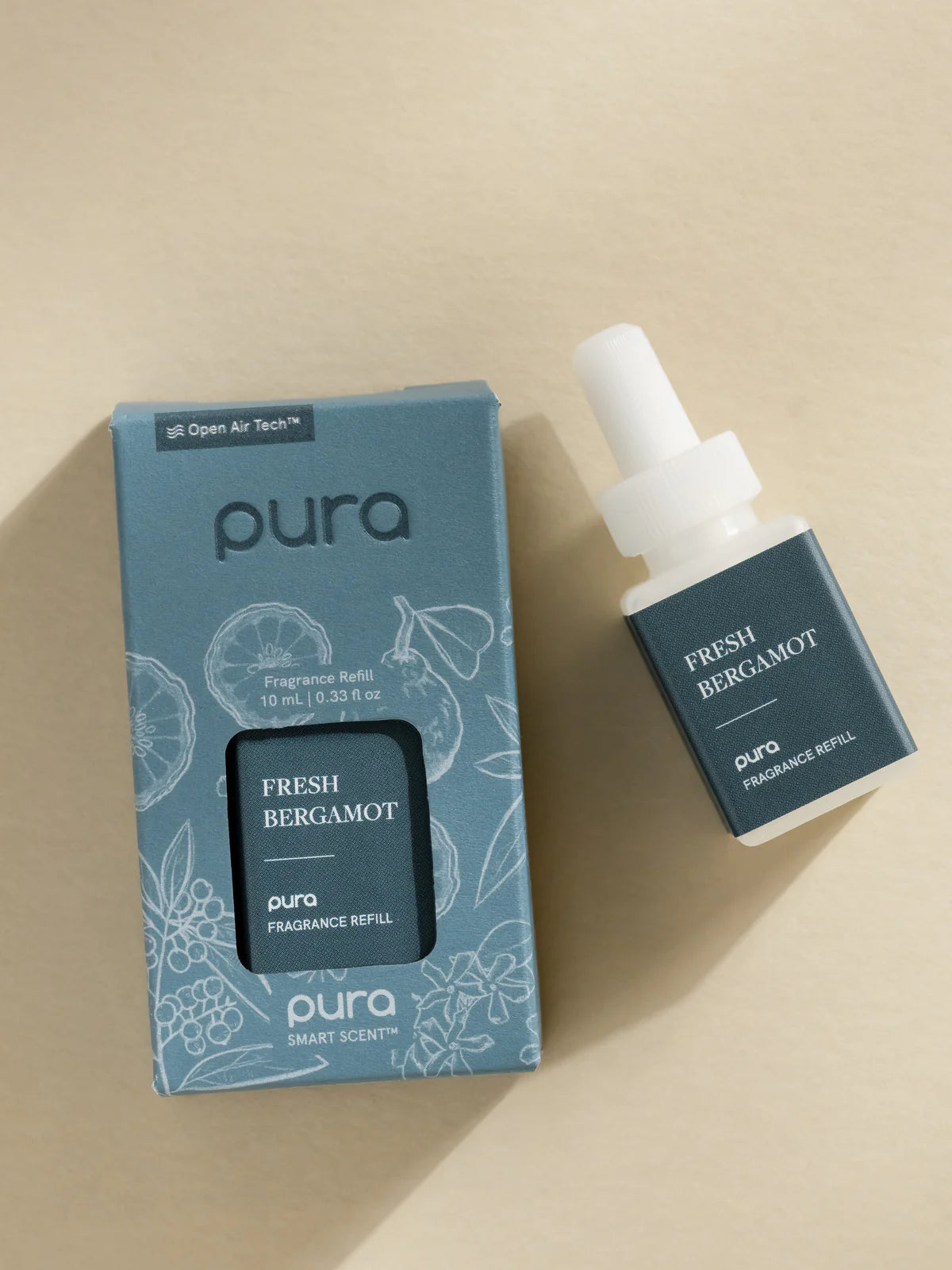 Pura Fresh Bergamot fragrance refill bottle and packaging on a beige background