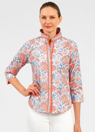 Woman wearing a floral-patterned jacket on a white background