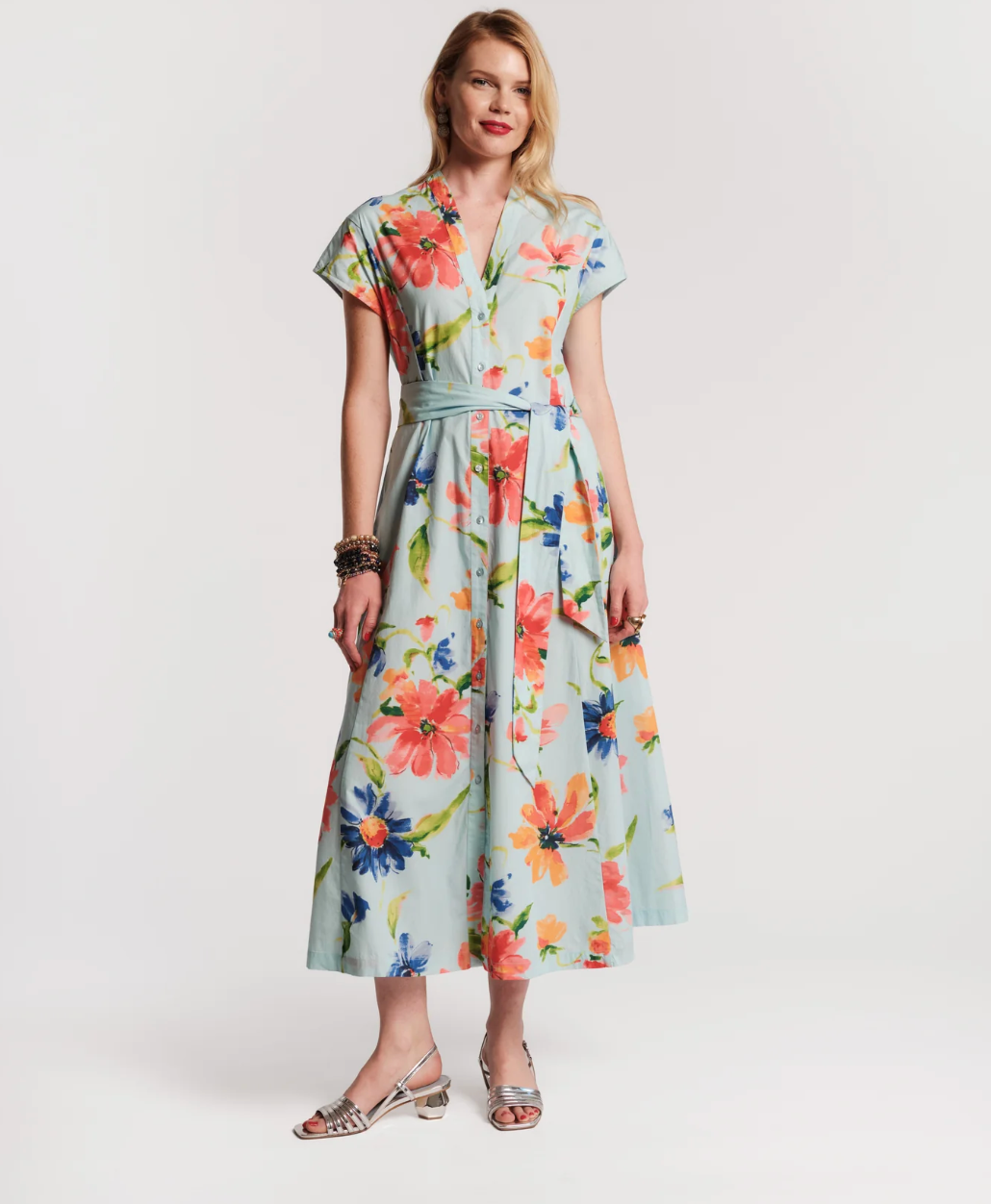 Woman wearing a floral dress on a white background