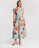 Woman wearing a floral dress on a white background