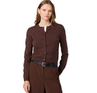 A woman modeling a dark brown button-front cardigan sweater over a white top, paired with brown trousers and a black belt, against a solid white background.