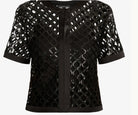 A black short-sleeve cropped jacket featuring an open lattice mesh pattern with a central satin tie detail and a matching satin hem, shown against a plain white background.