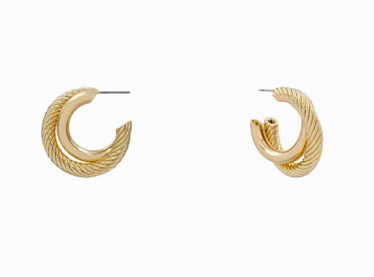 A pair of gold-toned twisted cable hoop earrings shown on a plain light gray background, with one earring facing forward and the other angled to show the side and post.
