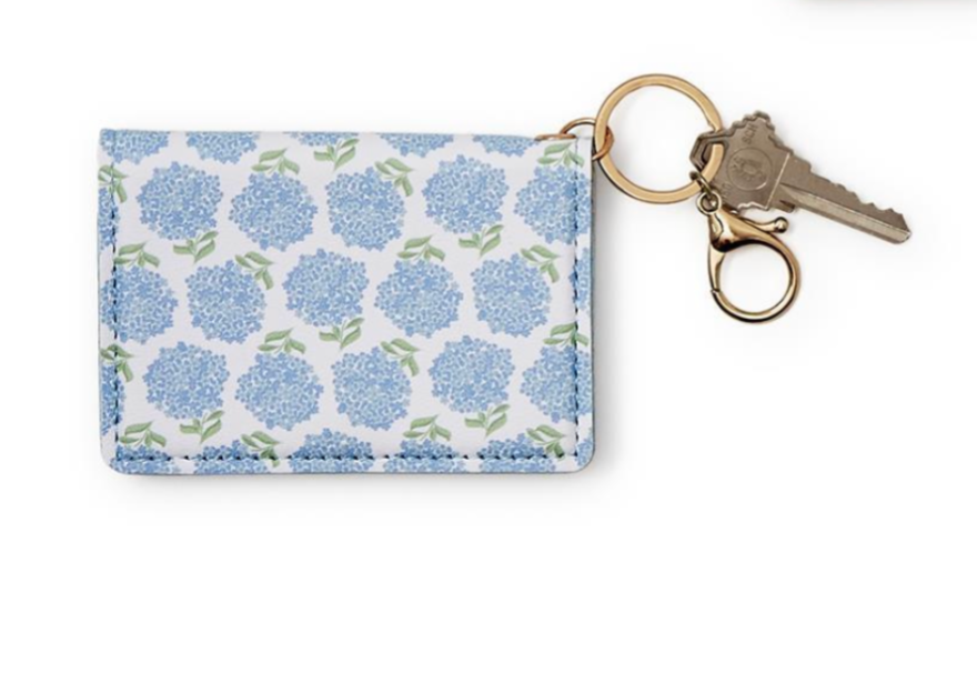 Floral patterned keychain cardholder with keys on a white background