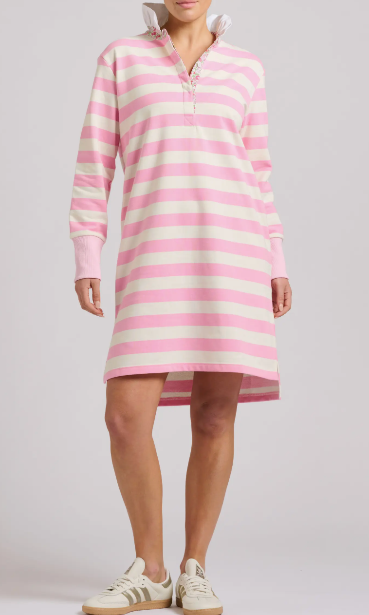 Person wearing a pink and white striped dress on a plain background