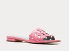 Pink sandal with cut-out design on a light gray background