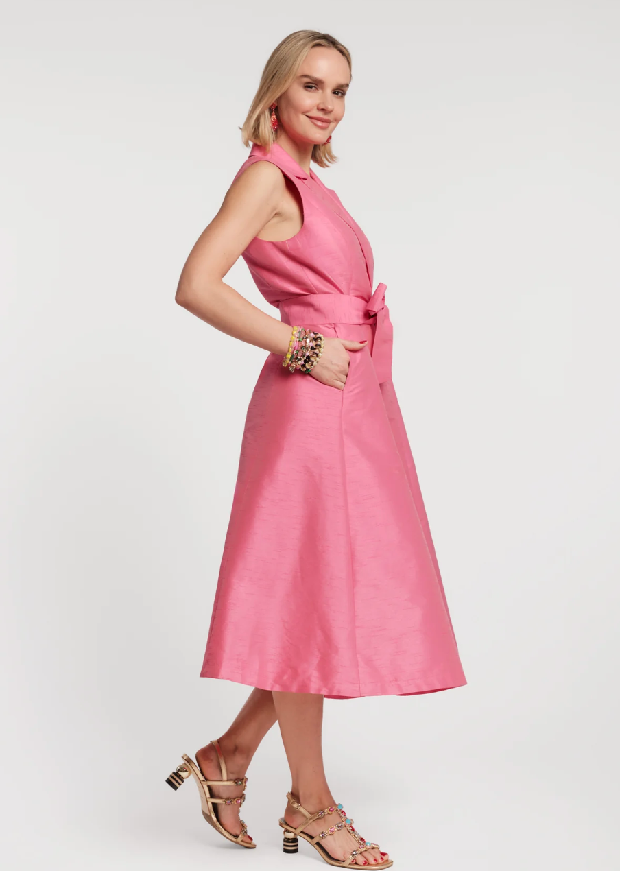 Woman wearing a pink dress on a white background