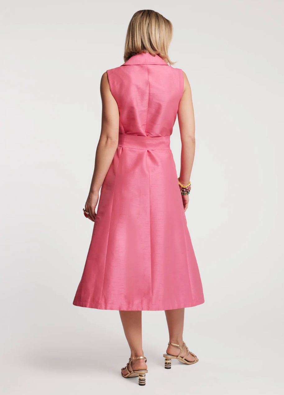 Woman wearing a pink sleeveless dress on a white background