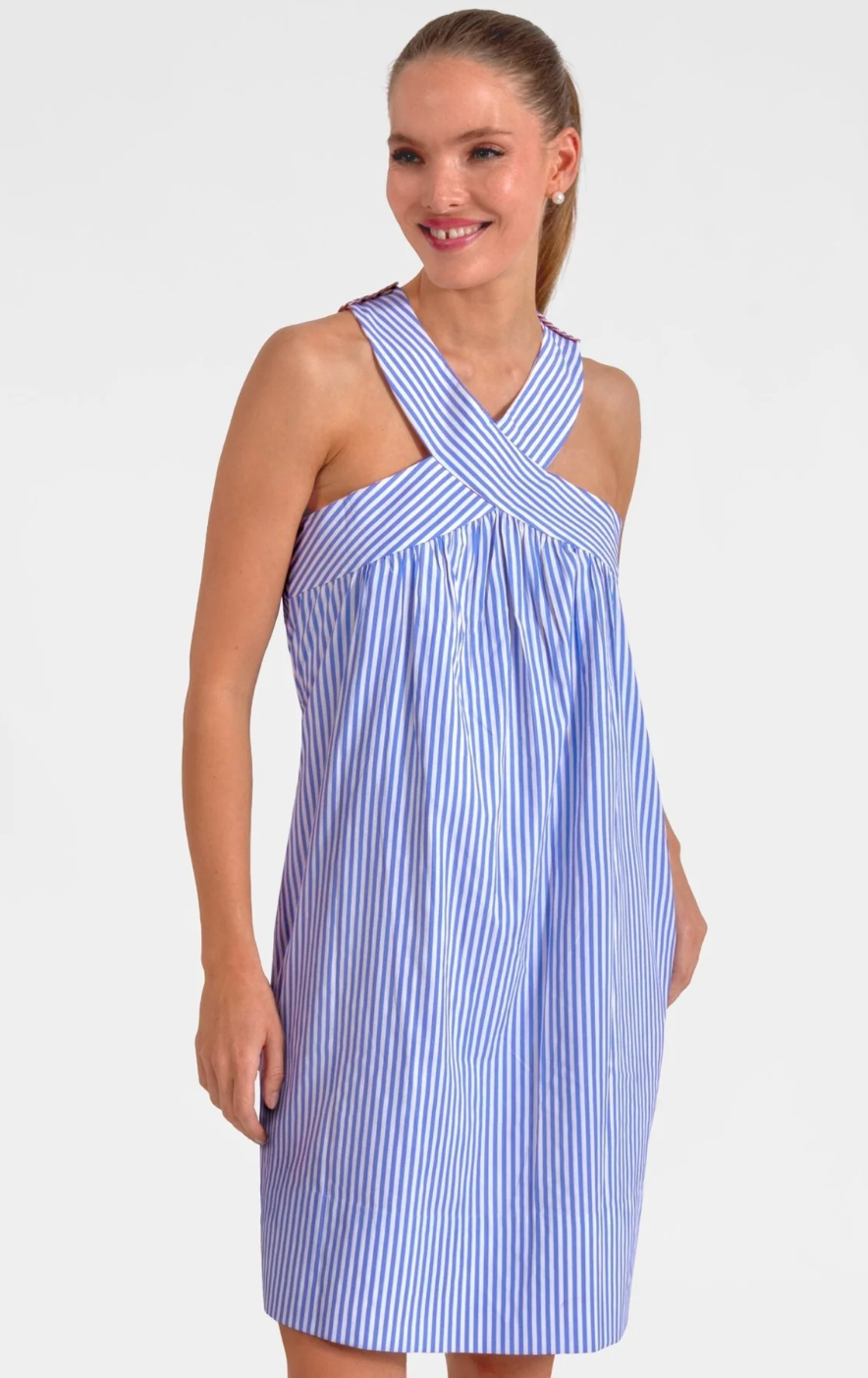 Woman wearing a blue and white striped dress on a white background
