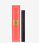 Coral packaging with black sticks on a white background