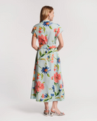 Woman wearing a floral dress on a white background
