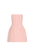 Pink strapless dress with a textured pattern on a white background