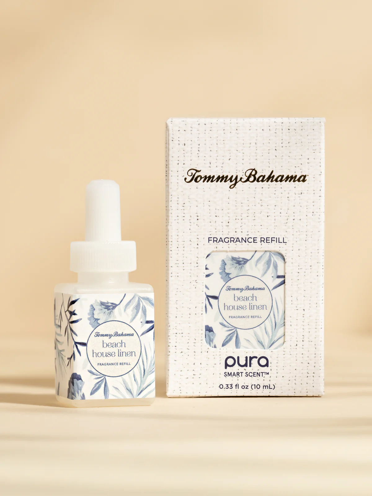 Tommy Bahama Pura Smart Scent fragrance refill bottle and packaging on a beige background