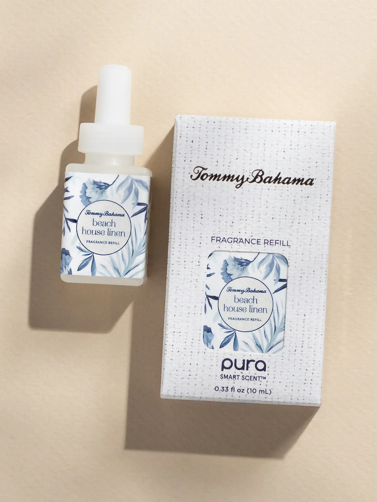 Tommy Bahama beach house linen fragrance refill bottle and packaging on a beige background