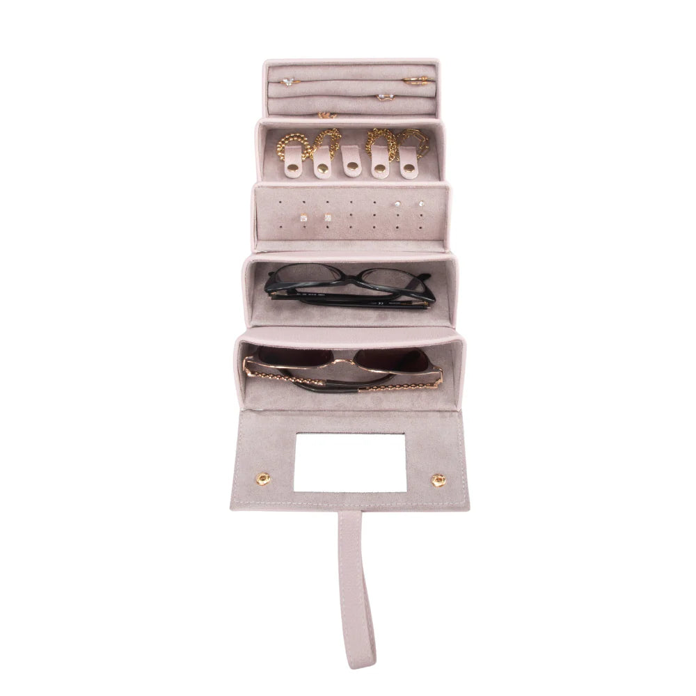 Pink jewelry and eyeglass organizer with compartments on a white background