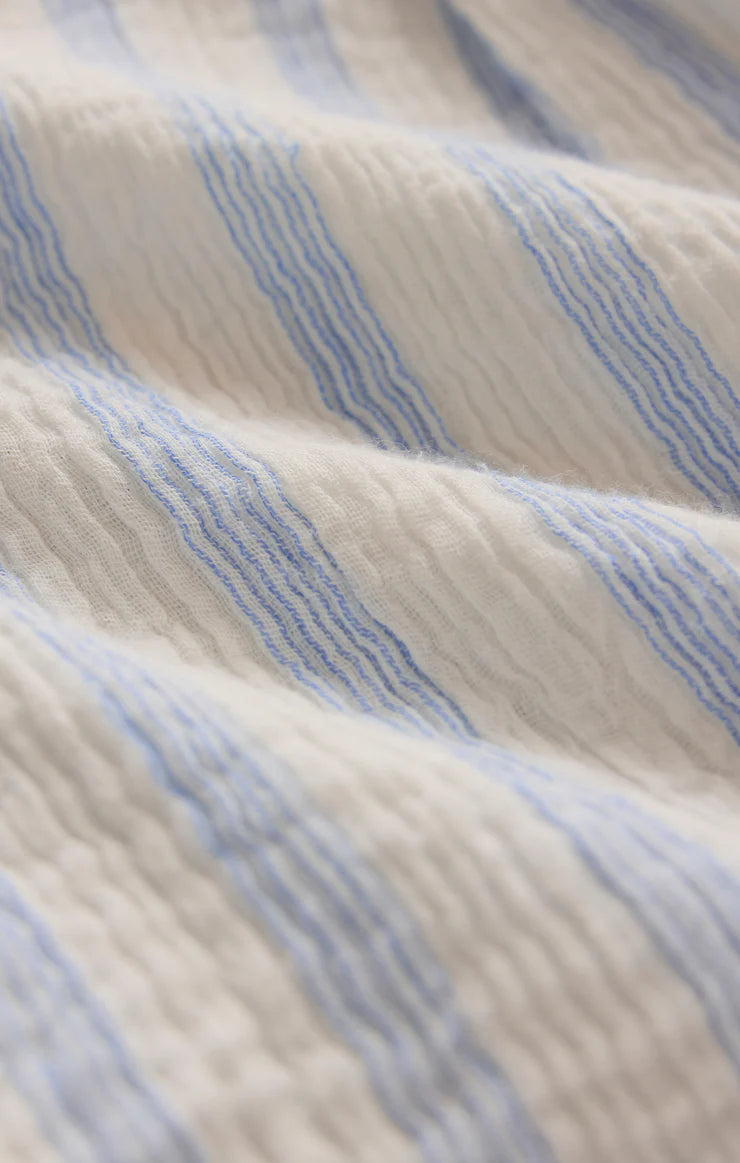 Close-up of blue and beige striped fabric texture