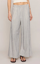 Striped wide-leg pants worn by a person on a plain background