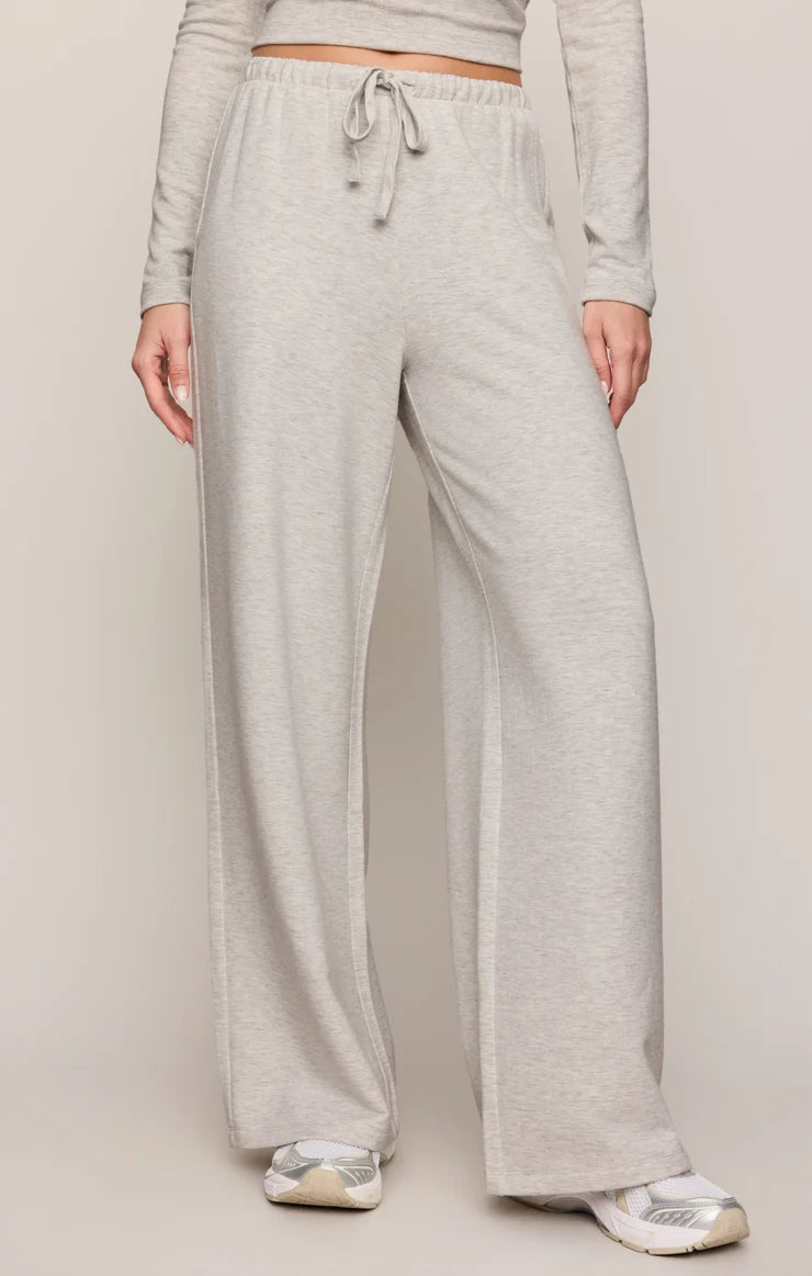 Wide-leg heather gray pants with an elastic drawstring waistband and side pockets.