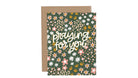 Greeting card with floral design and 'praying for you' text on a white background