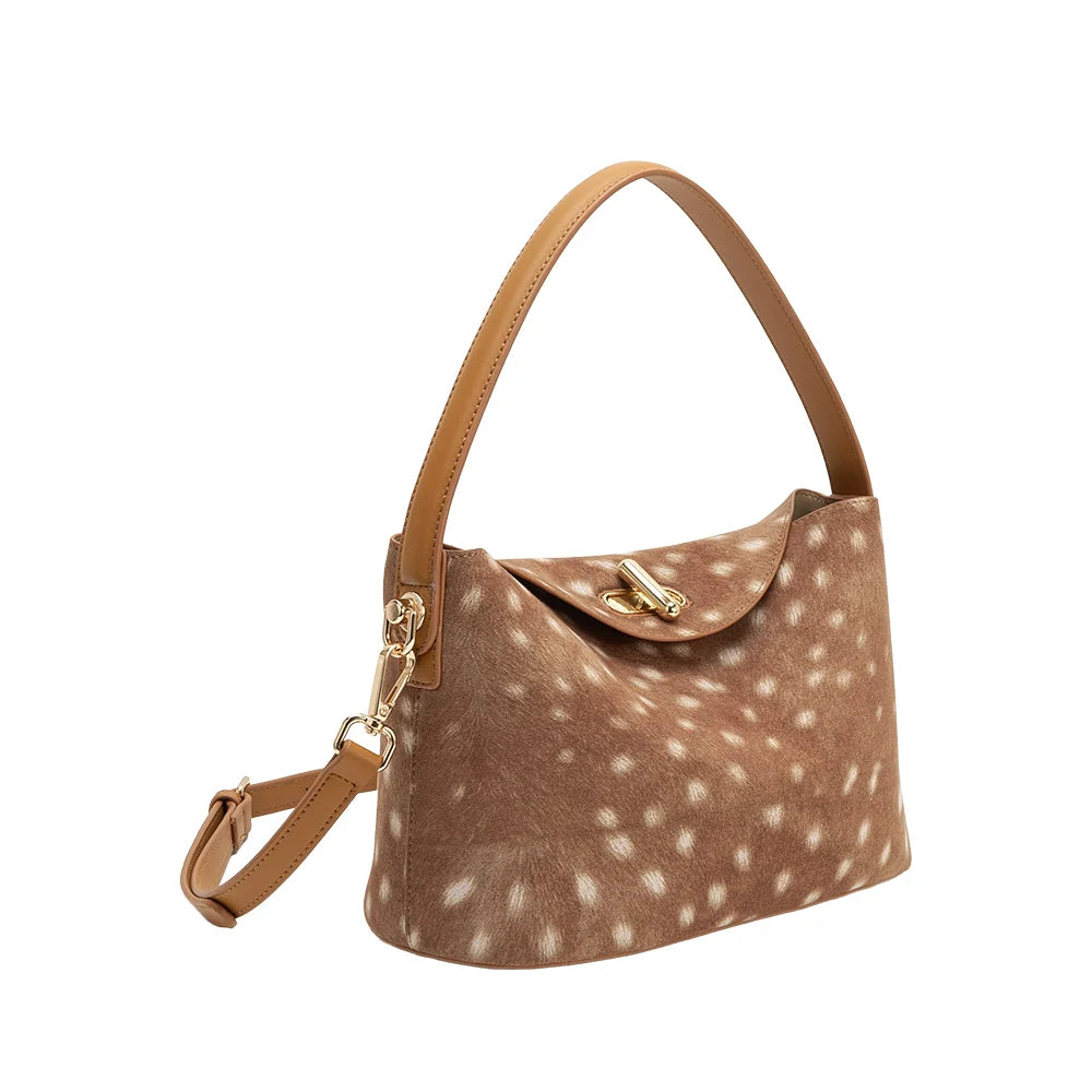 Brown handbag with white spots on a white background