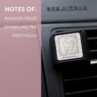 Car air freshener with 'Sweet Grace' label and fragrance notes on a car interior background