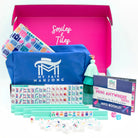 My Fair Mahjong game set with pink box, blue pouch, and colorful tiles on a white background