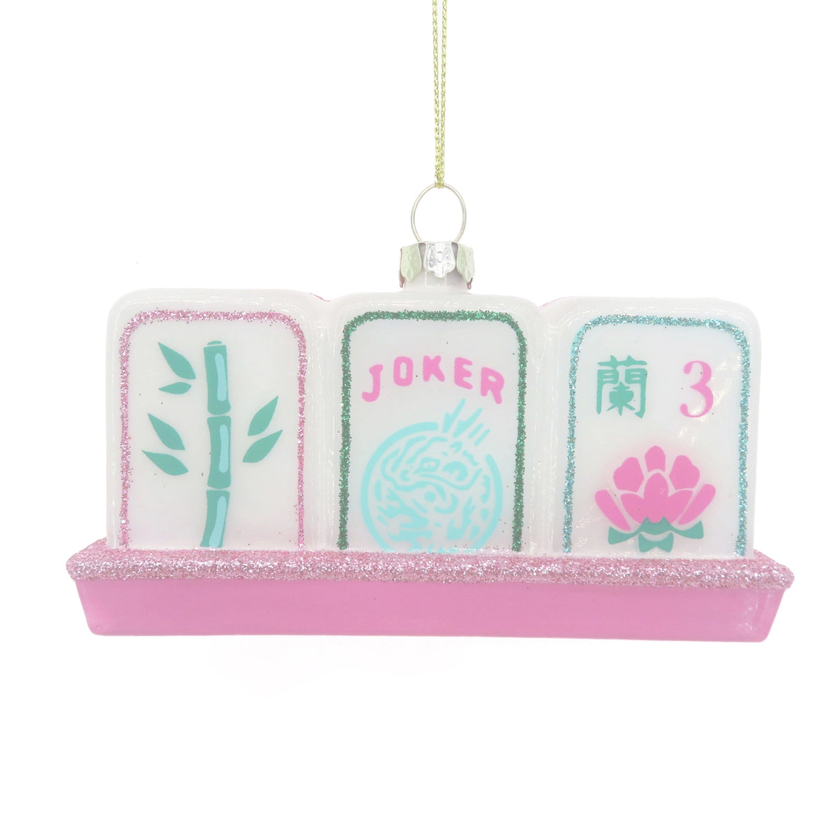 A decorative hanging ornament shaped like three Mahjong-style tiles on a pink glitter base, with a gold hanging string and a small clear rhinestone cap. The left tile shows green bamboo, the center tile says JOKER in pink with a light blue dragon motif, and the right tile shows a pink lotus and the number 3.