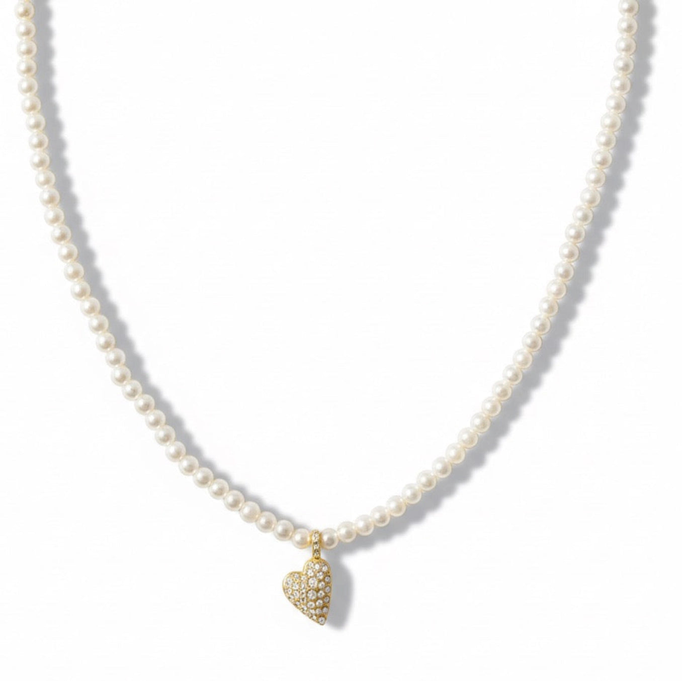 Pearl necklace with a gold heart-shaped pendant on a white background