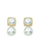 A pair of gold square stud earrings with round white freshwater pearls, displayed on a clean white background with a soft reflection below.