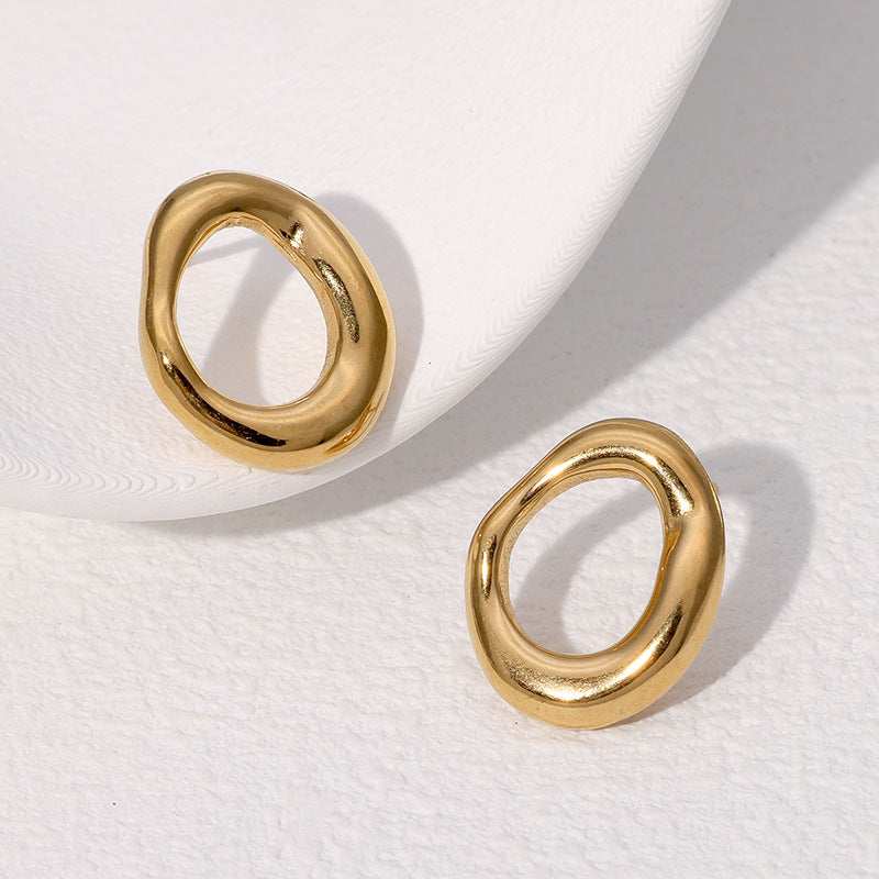Gold earrings on a white background