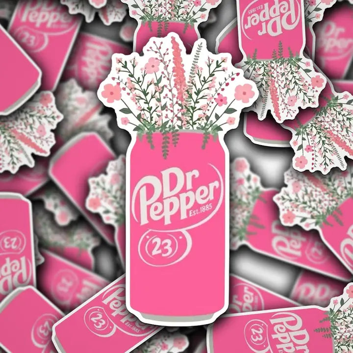 Pink Dr Pepper bottle-shaped sticker with floral design on a background of similar stickers.