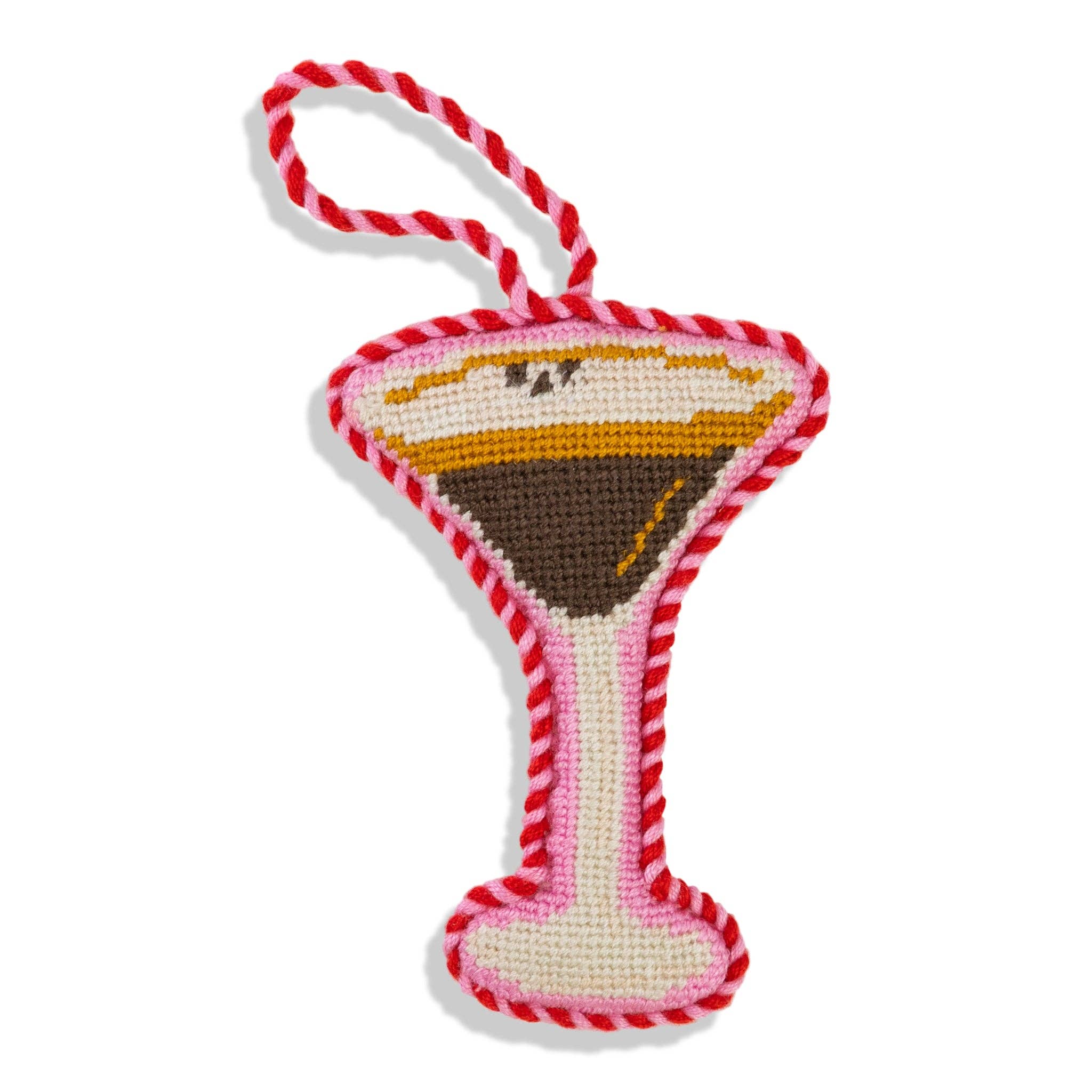 Chfristmas ornament like a martini glass with red and white striped handle on a white background
