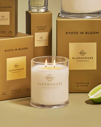 Glasshouse Fragrances candle with boxes in the background