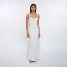 Woman wearing a white dress on a white background