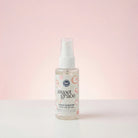 Bottle of sweet grace stain remover on a light pink background