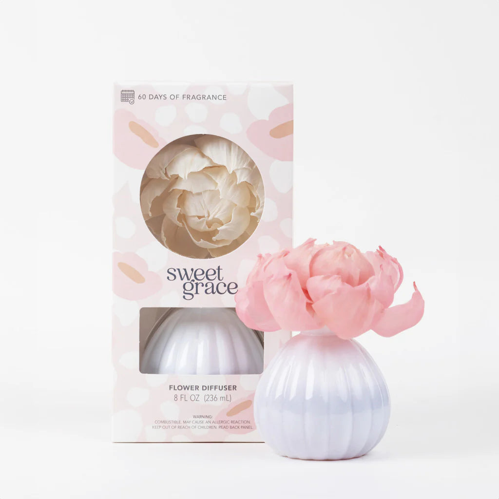 Sweet Grace Flower diffuser with pink flower and packaging labeled 'sweet grace' on a white background