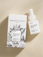 Brooklyn Candle Studio Maui fragrance bottle and packaging on a beige background