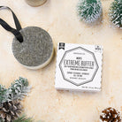 Men's Extreme Buffer with packaging on a textured surface with decorative elements