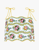 Floral patterned top with yellow straps on a white background